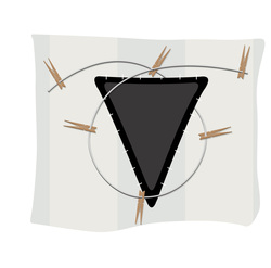 a picture of a black upturned triangle with a twist of clothesline around it.  There are pegs on the clothesline.